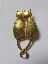 Broche dorée double chat "il