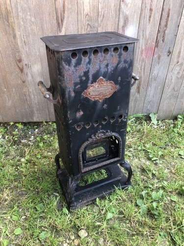 Ancien poêle pétrole - À,