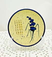 Gratte-ail en céramique ivoire bleu fleurs 11 x 1,5 cm env