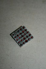 Broche ancienne en métal argenté et pierres Grenat