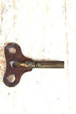 clé  papillon  pendule cartel