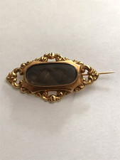 Broche reliquaire début XIXème en or avec cheveux tressés