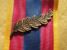 Agrafe Palme Bronze  pour citation Médaille Défense Nationale