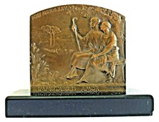 Plaque bronze  signée René