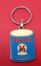 rare porte clé publicité peinture V33 - DOMBLANS - JURA  émaillé  a voir