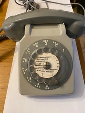 téléphone rétro fixe année 70 gris à cadran rotatif 