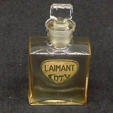 COTY L'AIMANT parfum touche oreille 57mm vide sans boite