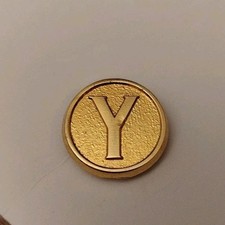 Pin's YSL Yves Saint Laurent signé Arthus Bertrand