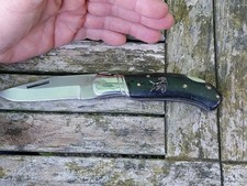 COUTEAU LAGUIOLE D AUBRAC RD CHASSE ANCIEN CHIEN SCULPTE DANS SON JUS DIM 21 CM 