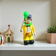 Clown mécanique vintage produit par New Bright Industrial Co., Ltd. en 1991.