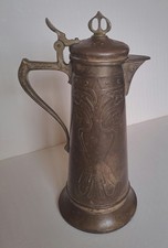 AIGUIÈRE EN BRONZE ET LAITON