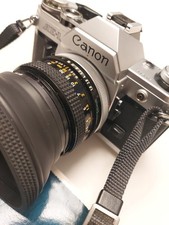Canon AE-1 + 50mm f/1.8 FD + Filtre UV + Pare Soleil + Pile Neuve , Flash Offert