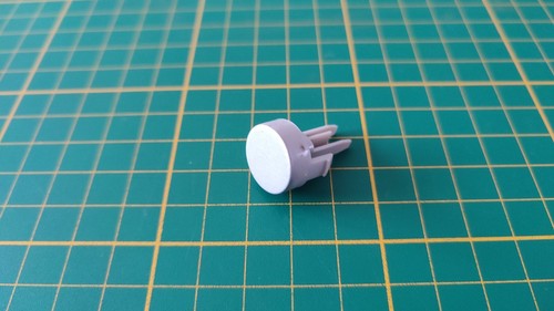 Bouton gris reset pièce