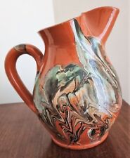 pichet en terre melee