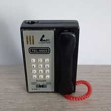 Briquet Tempête publicitaire RINGER en forme de Téléphone 