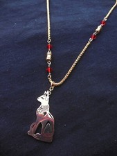 Chat égyptien Bastet doré