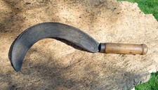 Serpe ancienne en acier fondu