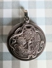 Ancien joli pendentif miroir