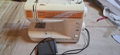 Machine coudre - à,