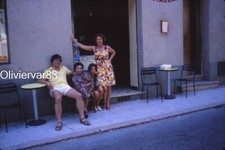 Vintage photo slide 1970s - 3 women and a man on small bar terrace