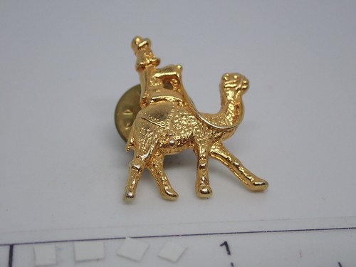 Man riding camel gold - camel,