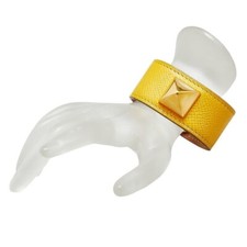Authentique bracelet Hermès Medor clous en cuir jaune fabriqué en France