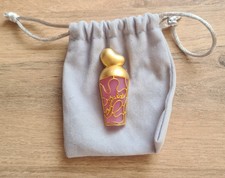 Broche Nina Ricci neuve or et rose livrée avec pochette bijoux