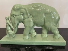 ELEPHANT ET SON CORNAC CRAQUELÉ