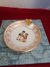 Assiette chauffante pour bébé ,avec bouchon , en porcelaine de Limoges.