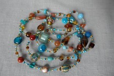 Long collier sautoir en perles