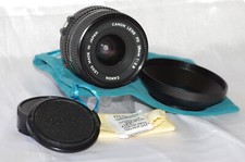 Objectif 28mm f2,8 CANON, monture FD, avec bouchons, pare-soleil et housse, TBE