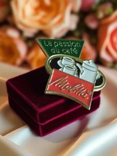 Pin's publicitaire vintage en