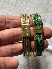 Lot de deux bracelets métal dont un Charles Jourdan