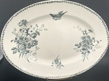 Plat ovale demi-porcelaine E. Bourgeois décor fleuri & oiseau 36 cm