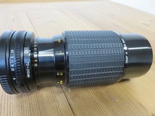 Objectif SIGMA ZOOM KII - 1 : 4,5 F =70 - 210 mm  pour Canon FD / Bouchons /Etui