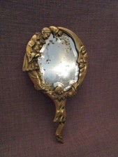 Miroir ancien face a main en