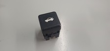 Rear trunk opening button for