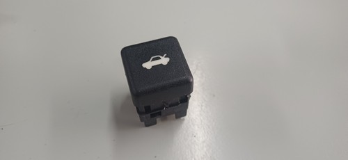 Rear trunk opening button for