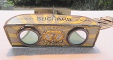 Ancien stéréoscope publicitaire chocolat SUCHARD tôle lithographiée 1900