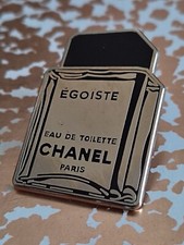 pin's parfum " EGOISTE" Chanel argenté.