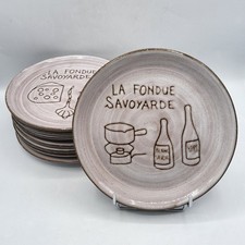 Huit assiettes à fondue