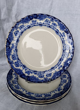 4 assiettes plates en faïence