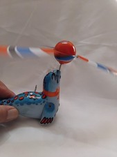 Ancien Jouet mécanique  a Clés  otarie  ou Phoque  Jongleur