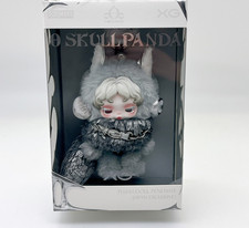 Pendentif poupée en peluche