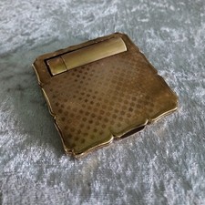 Poudrier et porte rouge à lèvres en métal doré des années 60