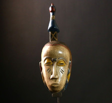 Masque africain vintage fait