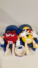 Red Plain & Yellow Peanut M & M Candy Dispenser At The MOVIES Blue Chairs