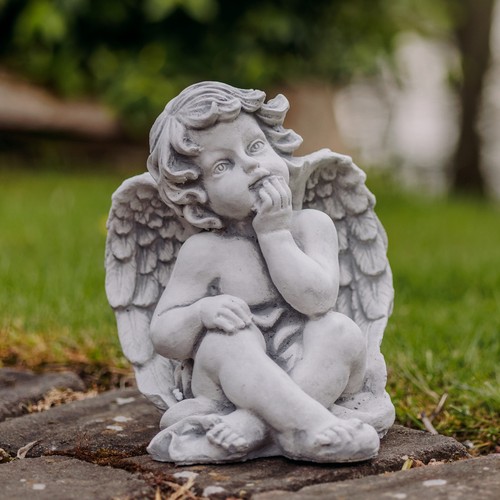 Ange assis statuette - , pierre