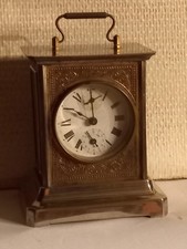 ancienne pendule de voyage d'officier musicale en metal chromé et laiton fin XIX