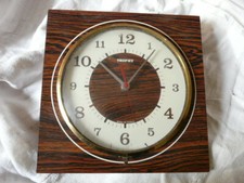 Ancienne pendule murale formica façon bois TROPHY